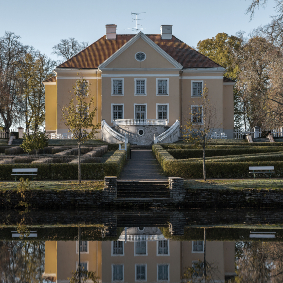 Rich manor with a park and a pond at sunrise. Palmse, Estonia.